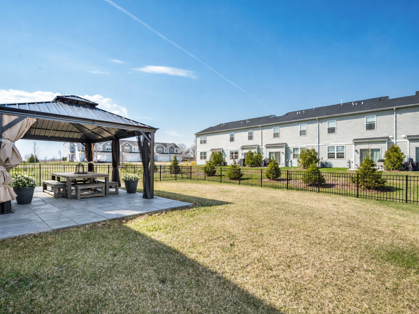 444 Radcliff Lane South Elgin, IL 60177 - Photo 25 of 26 a view of a patio with table and chairs under an umbrella