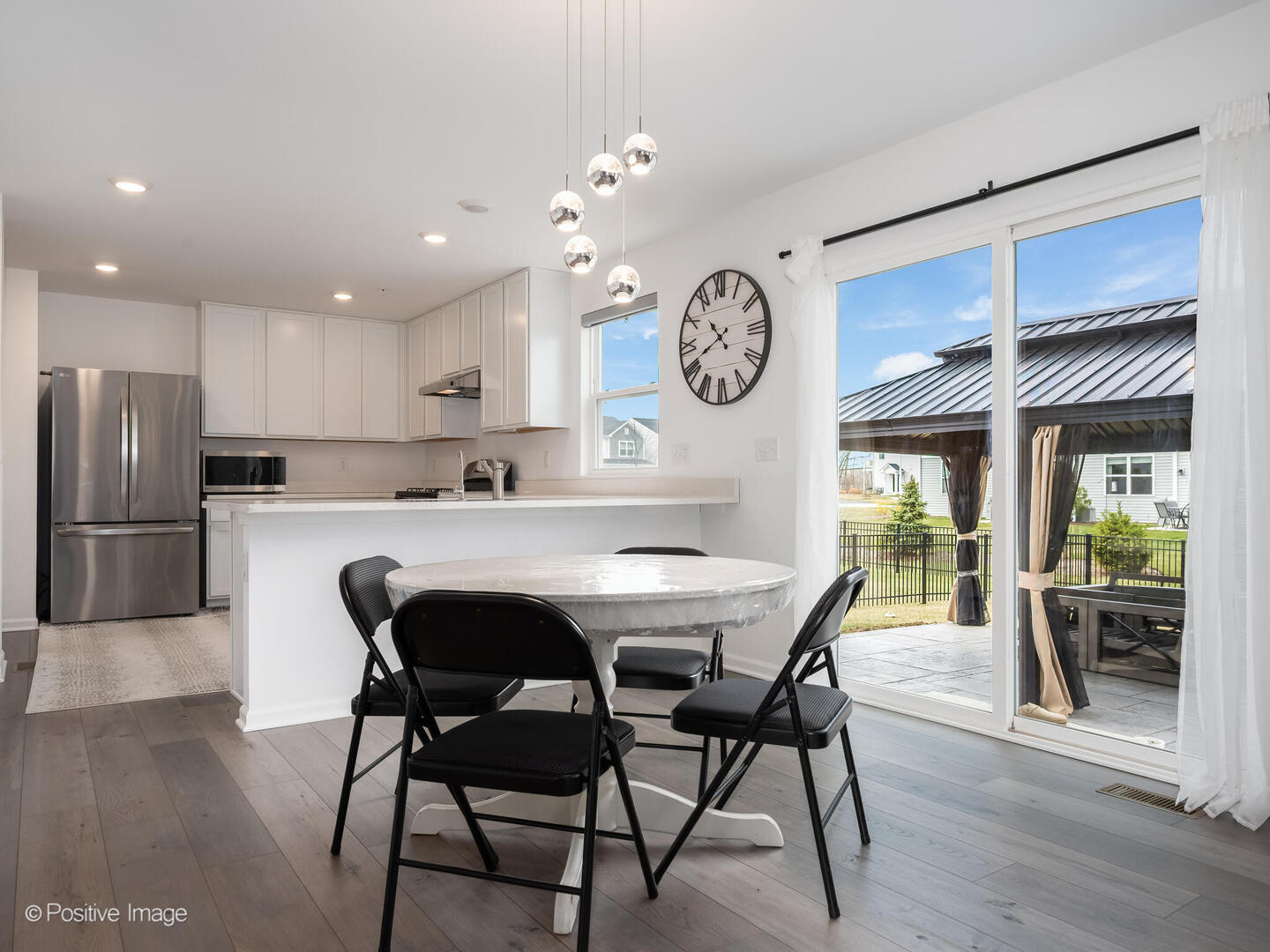 444 Radcliff Lane South Elgin, IL 60177 - Photo 8 of 26 a kitchen with stainless steel appliances granite countertop a table chairs a sink and dishwasher
