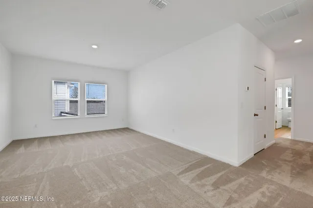 a kitchen with stainless steel appliances a stove a sink and a refrigerator