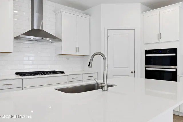a bathroom with a sink toilet vanity and shower