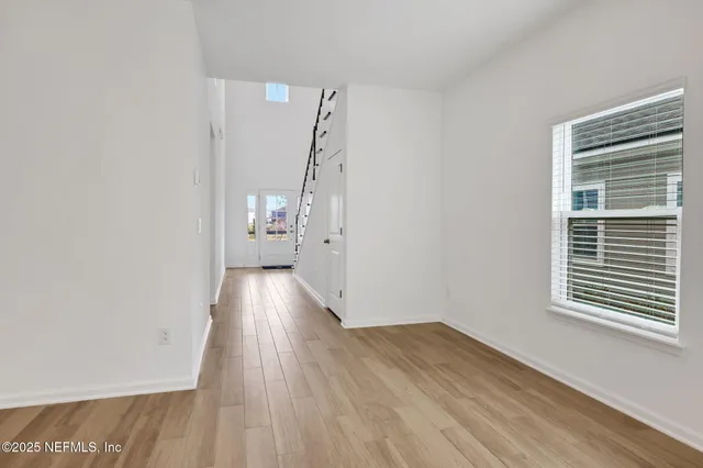 a view of a city with lots of residential buildings lake and ocean view