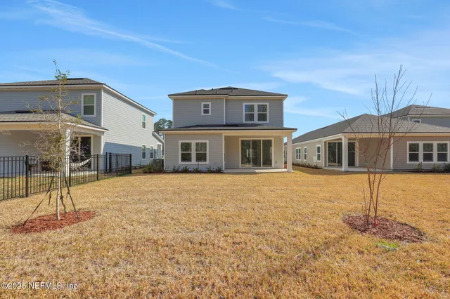 a view of a park with large trees