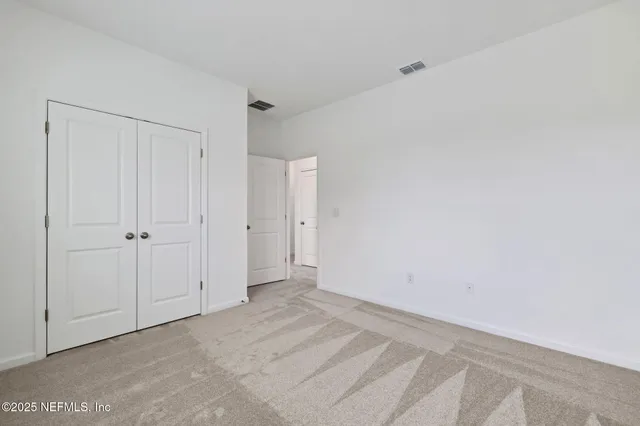 a bathroom with a double vanity sink a mirror and a shower