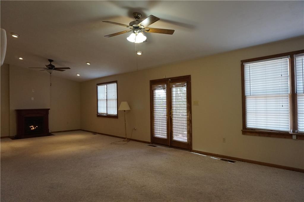 12 Tidball Road Pittsburgh, PA 15205 - Photo 5 of 14 FAMILY ROOM WITH DOORS TO OVERSIZED DECK, GAS FIREPLACE WITH HOOK UPS FOR TELEVISION ABOVE FIREPLACE, CATHEDRAL CEILING WITH RECESSED LIGHTS AND CEILING FANS