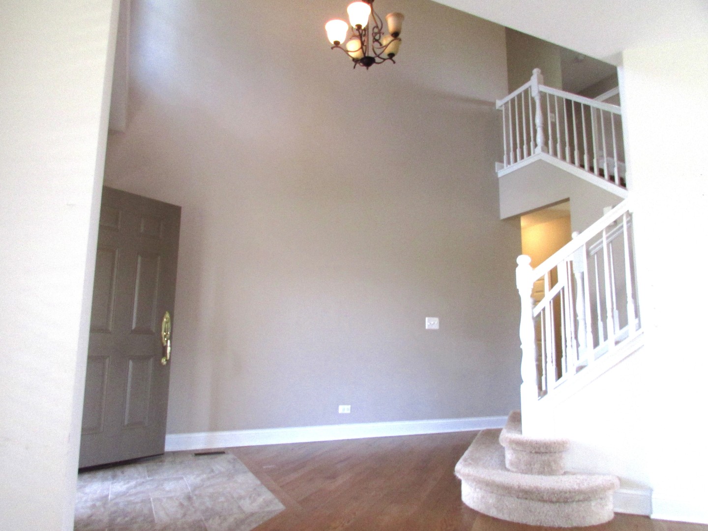 10123 Ashley Street Huntley, IL 60142 - Photo 11 of 33 a view of an entryway with a chandelier
