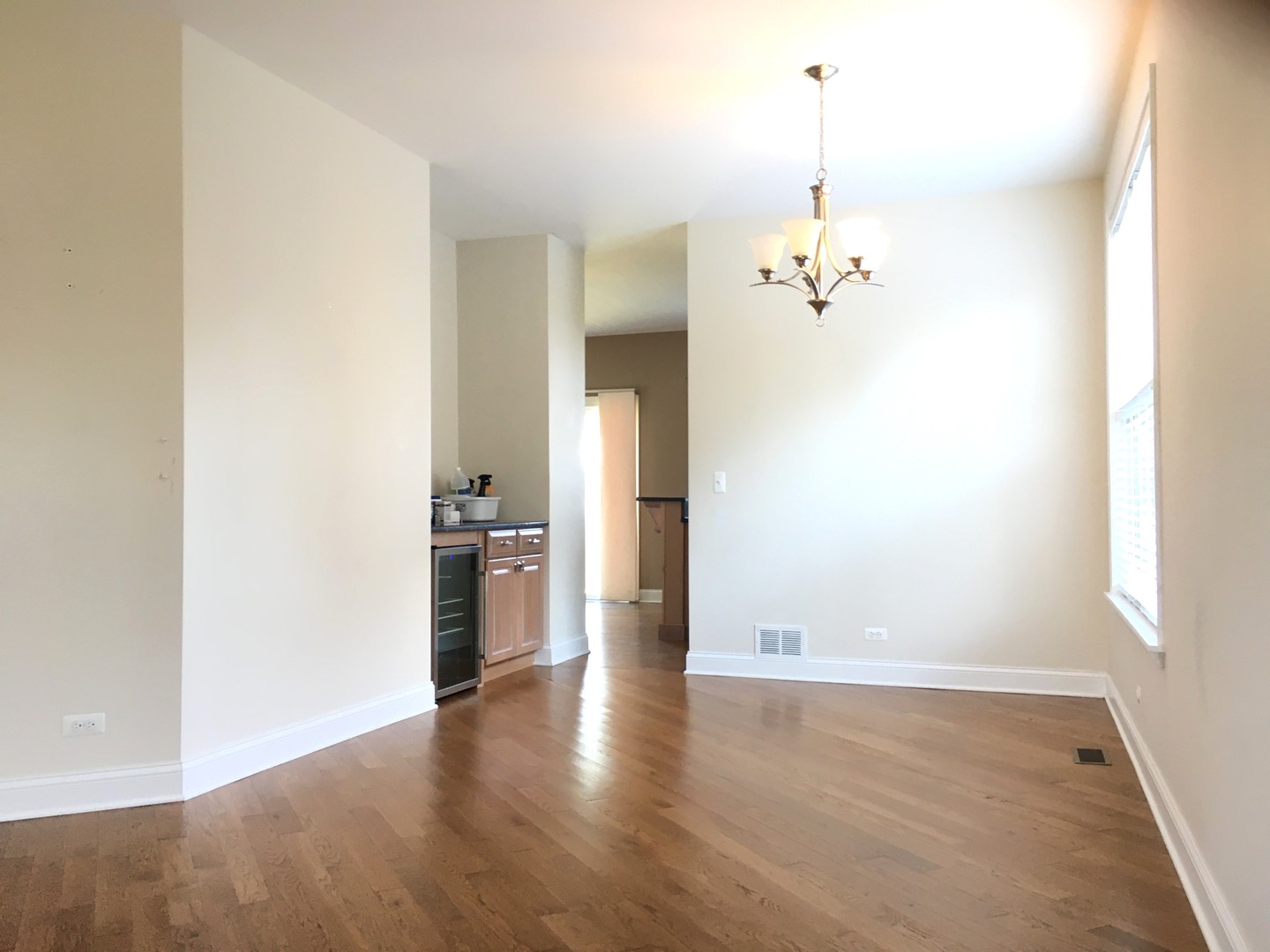 10123 Ashley Street Huntley, IL 60142 - Photo 12 of 33 an empty room with cabinet and a chandelier