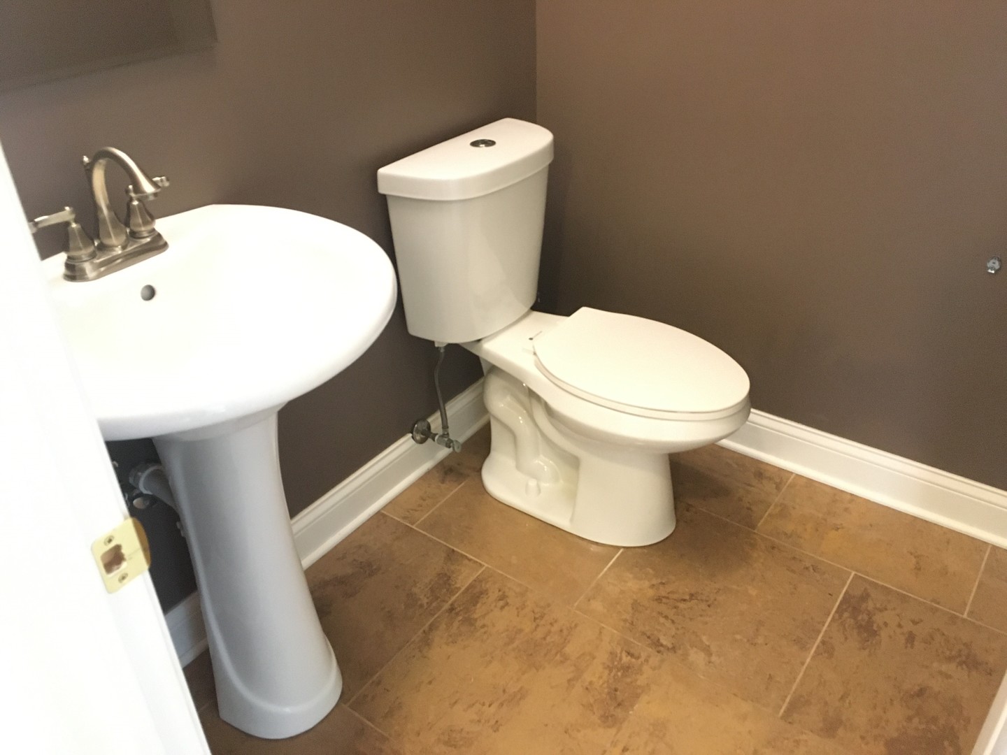 10123 Ashley Street Huntley, IL 60142 - Photo 20 of 33 a white toilet sitting next to a white sink