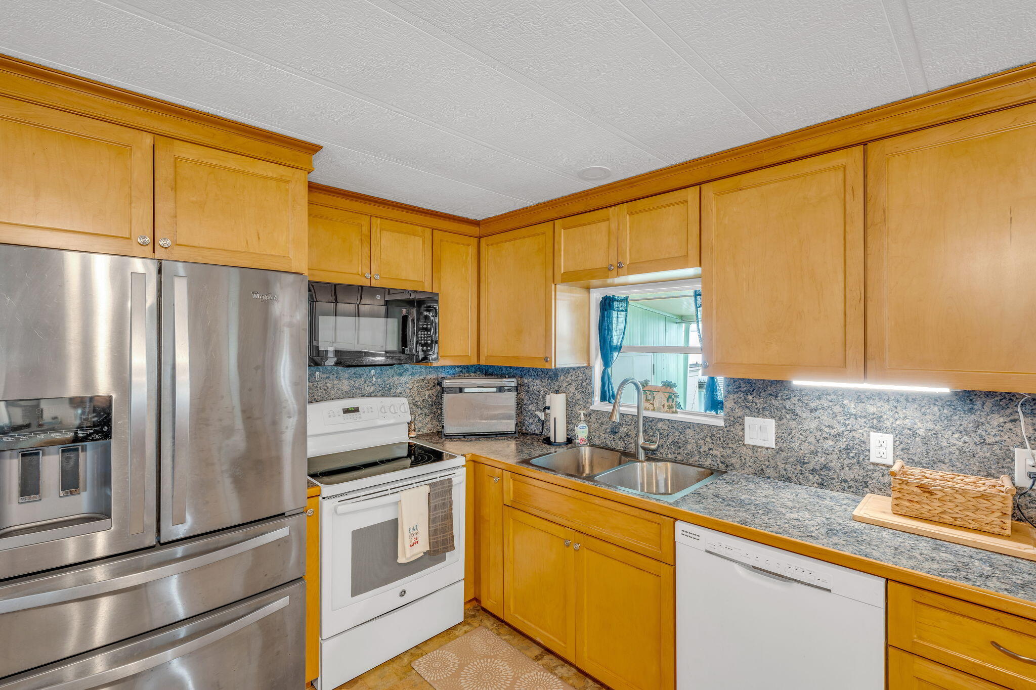 808 South Silver Circle Key Largo, FL 33037 - Photo 3 of 49 a kitchen with stainless steel appliances a sink cabinets and a window