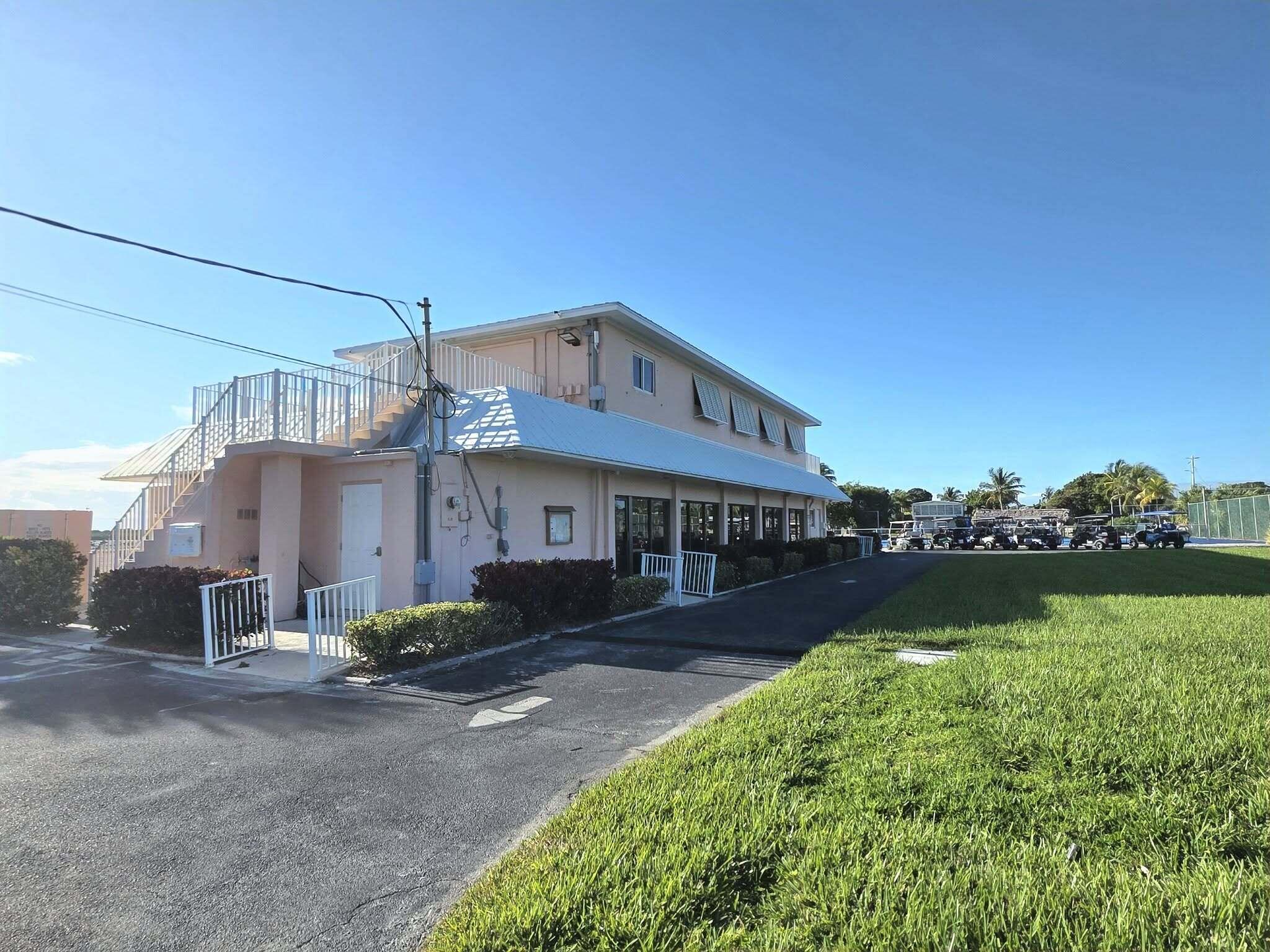 808 South Silver Circle Key Largo, FL 33037 - Photo 46 of 49 a front view of a house with garden