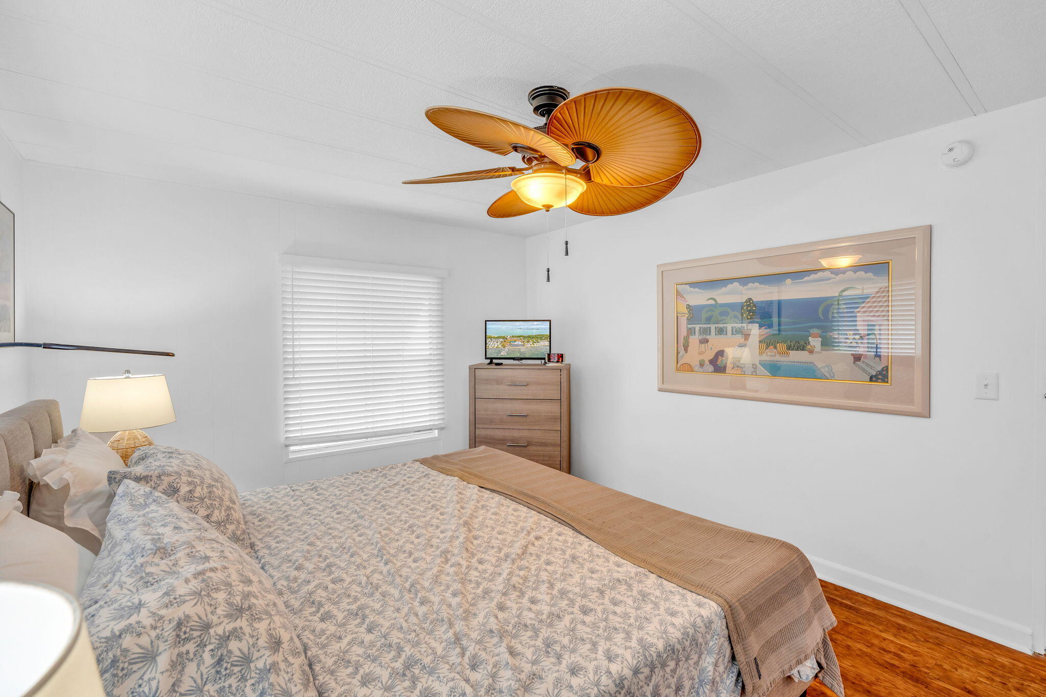 808 South Silver Circle Key Largo, FL 33037 - Photo 10 of 49 a bedroom with a bed and a chandelier