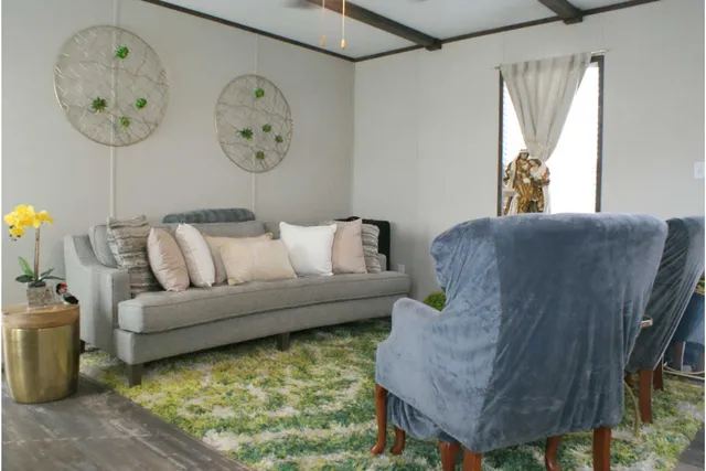 a living room with furniture and a large window