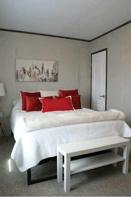 501 Mesquite Road San Marcos, TX 78666 - Photo 15 of 33 Bedroom featuring crown molding, a closet, and a decorative wall