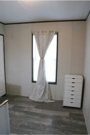 a view of room with stairs and a window