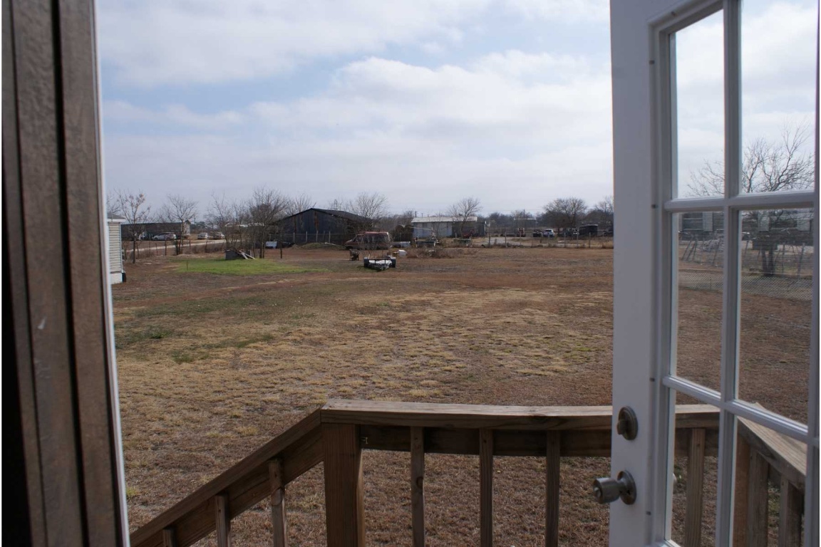 501 Mesquite Road San Marcos, TX 78666 - Photo 28 of 33 View of yard featuring a balcony