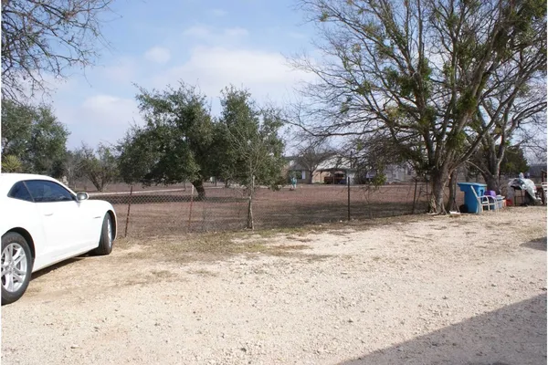 a view of a yard with a tree