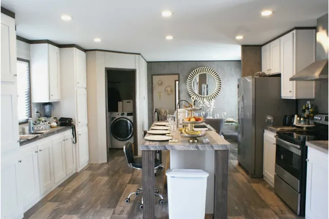 a kitchen with a sink stove and refrigerator