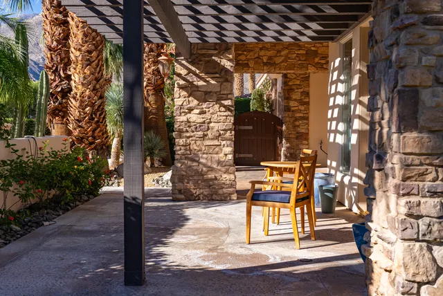 a view of a dining room with furniture and a chandelier