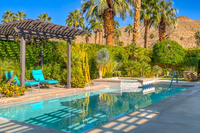 a view of a swimming pool with a patio