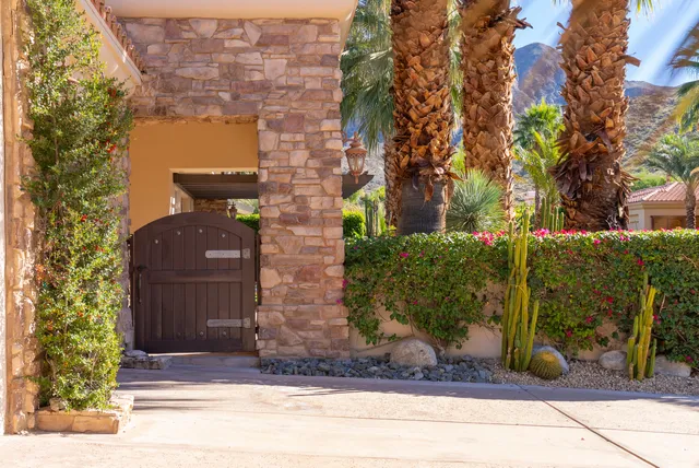 a front view of a multi story residential apartment building with a yard