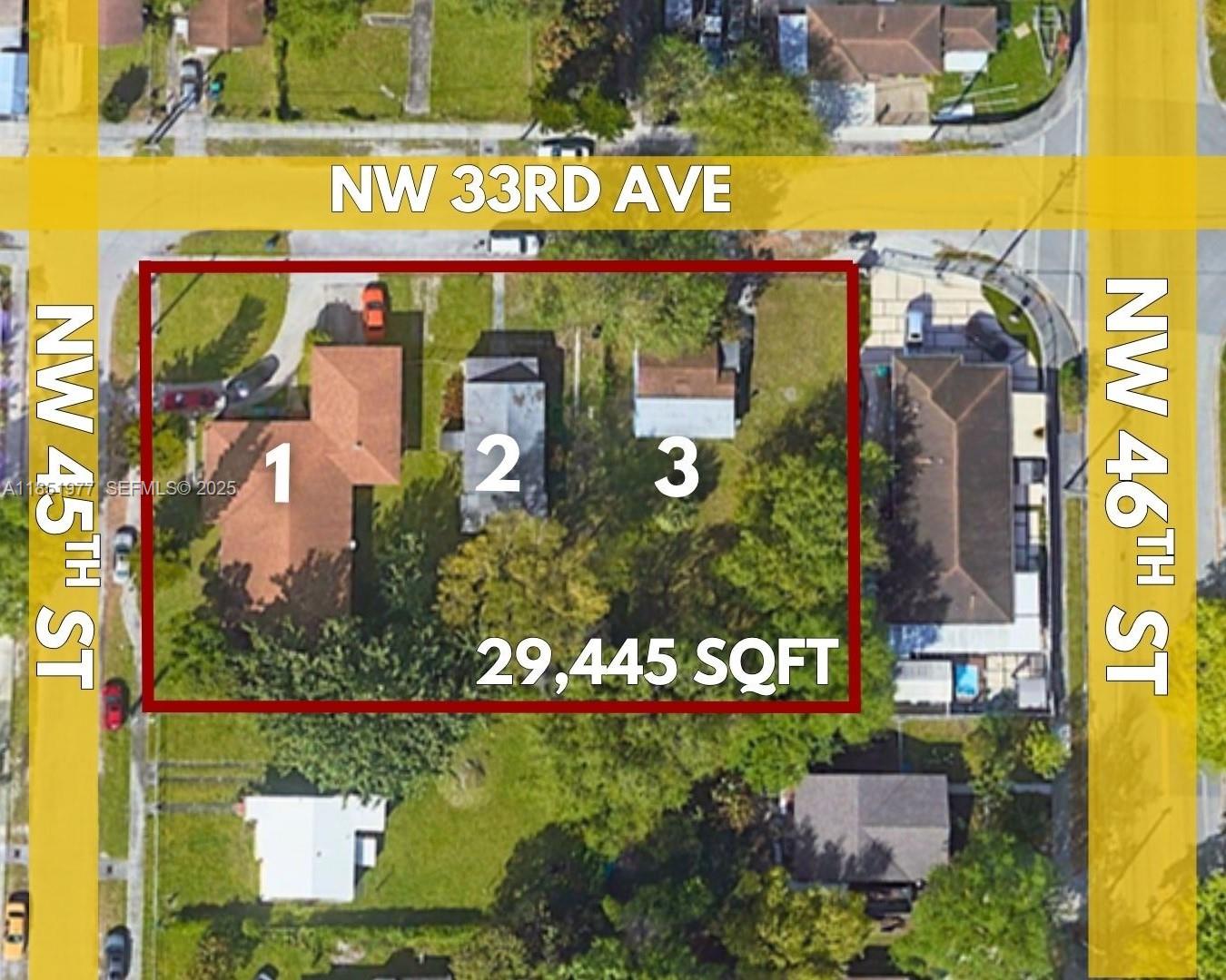 a street sign on a wall next to a building