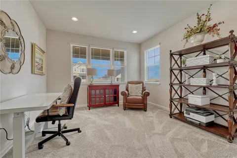 a living room with furniture and a table