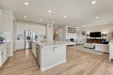 a bathroom with a sink a toilet a shower and a mirror