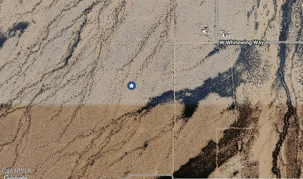 a view of a backyard of the house