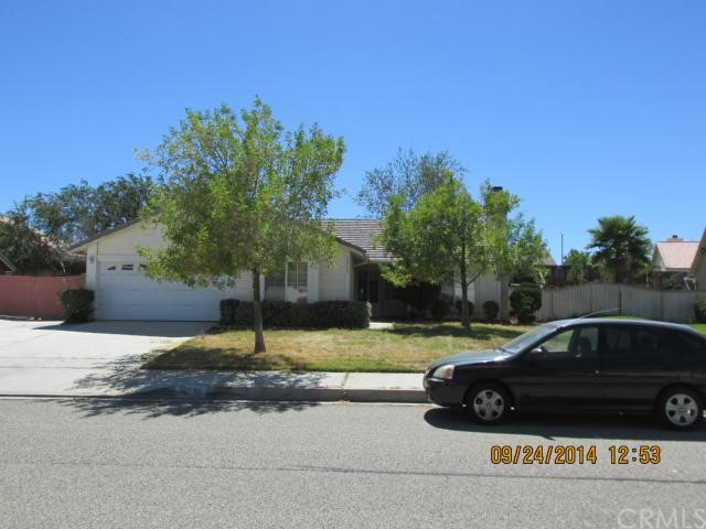 12795 Brant Road Victorville, CA 92392 - Photo 1 of 1 a car parked in front of a house