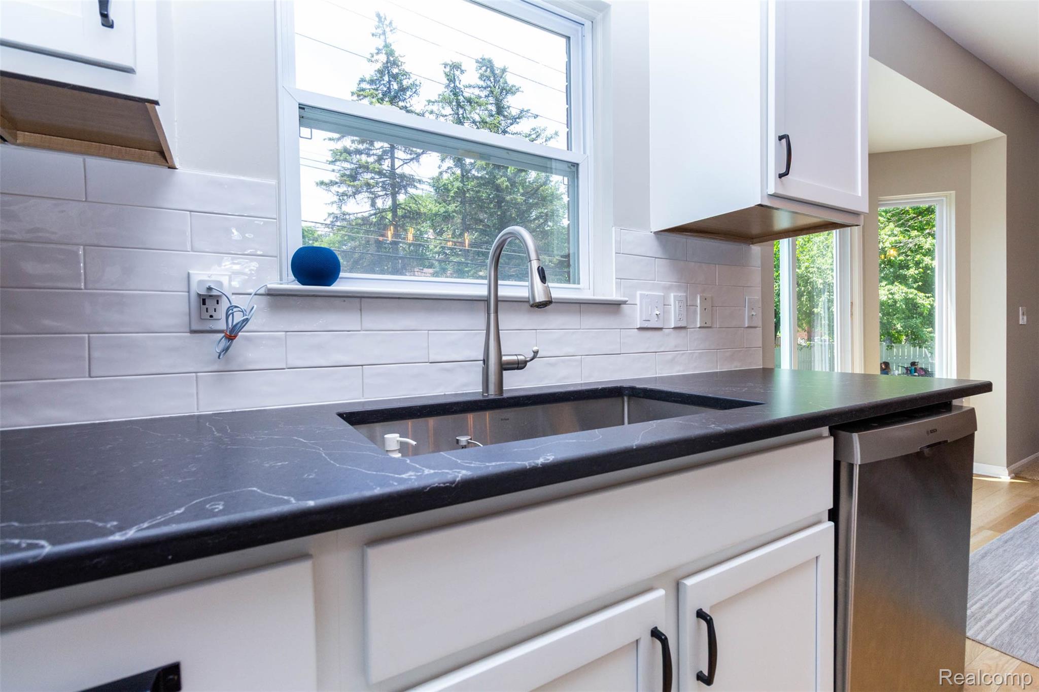 36039 Curtis Road Livonia, MI 48152 - Photo 14 of 61 Kitchen workstation with an undermount stainless steel sink and a pull-down faucet