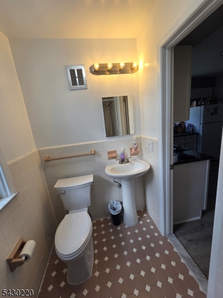 166 Carmita Avenue Rutherford, NJ 07070 - Photo 15 of 27 a bathroom with a sink toilet and shower