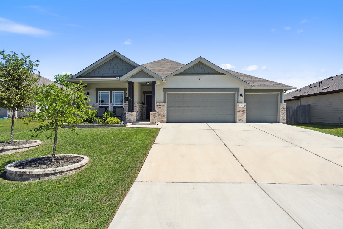 a front view of a house with garden