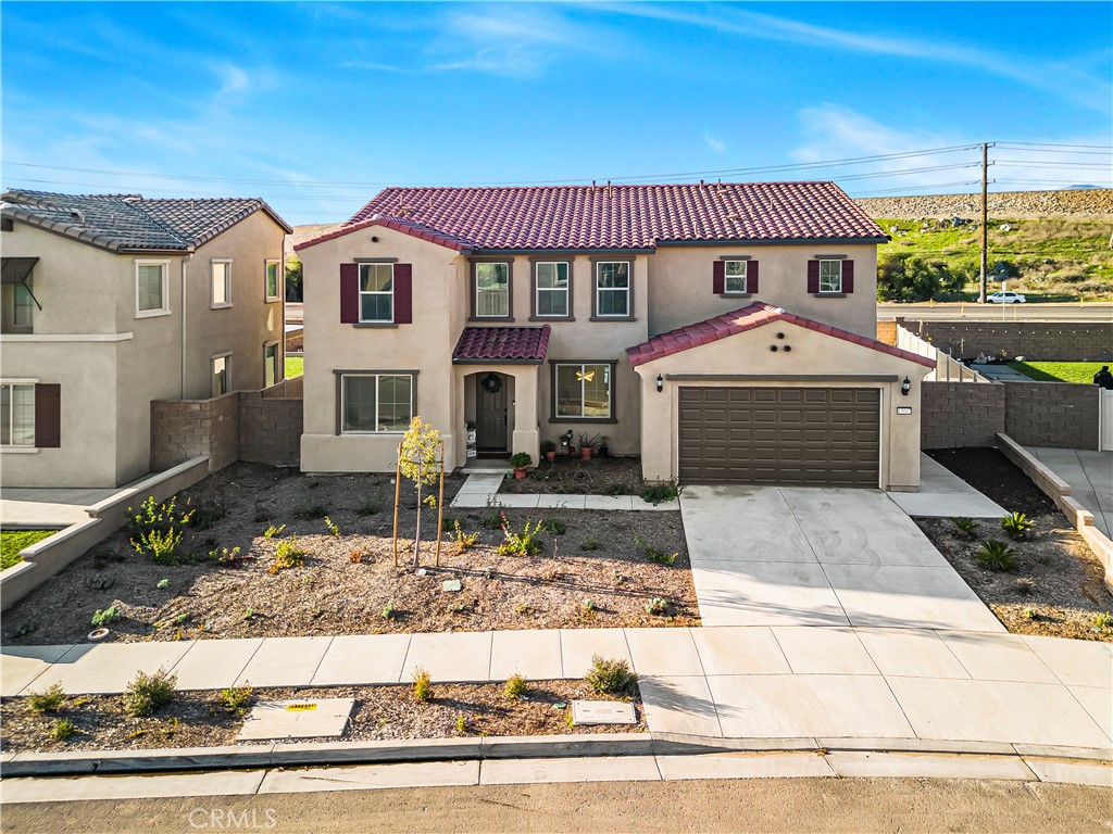 13007 High Valley Drive Riverside, CA 92503 - Photo 1 of 1 a front view of a house with a yard