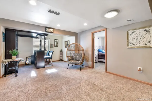 a living room with furniture and a area