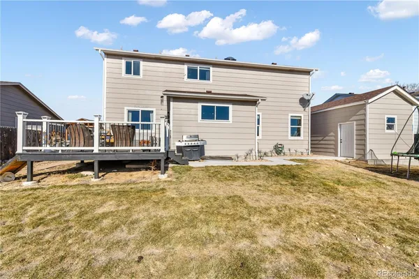 an aerial view of a house with basket ball court