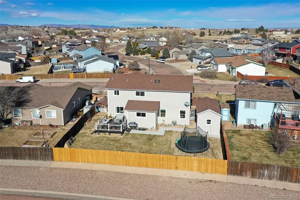 an aerial view of residential houses with outdoor space
