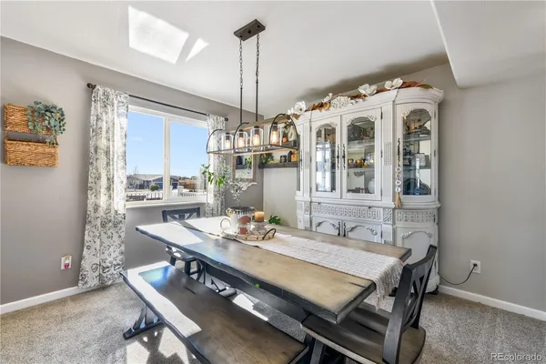 a dining room with a table and chairs
