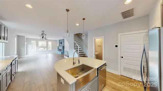 a living room with table and chairs