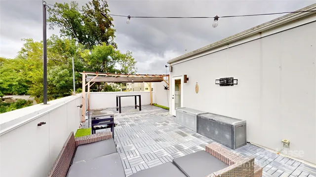 a view of a patio with a table and chairs