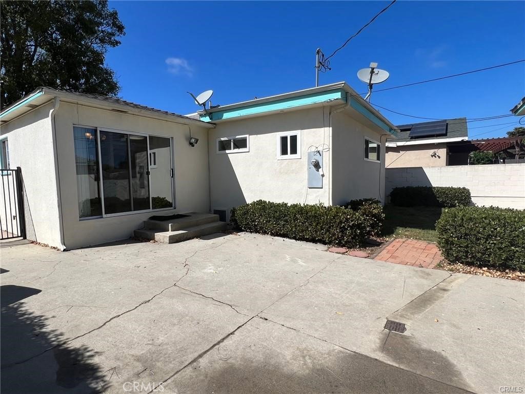 8400 Fordham Road Westchester, CA 90045 - Photo 11 of 25 a front view of a house with a yard