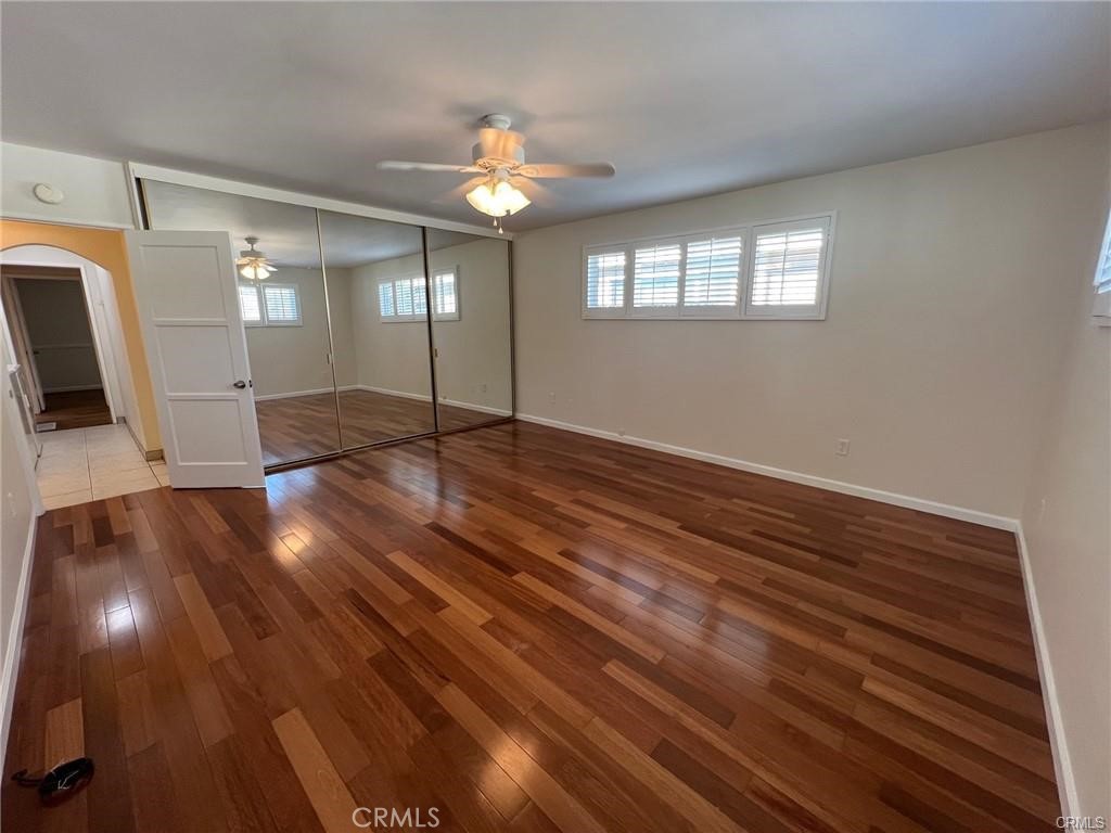 8400 Fordham Road Westchester, CA 90045 - Photo 17 of 25 a view of an empty room with wooden floor and a window