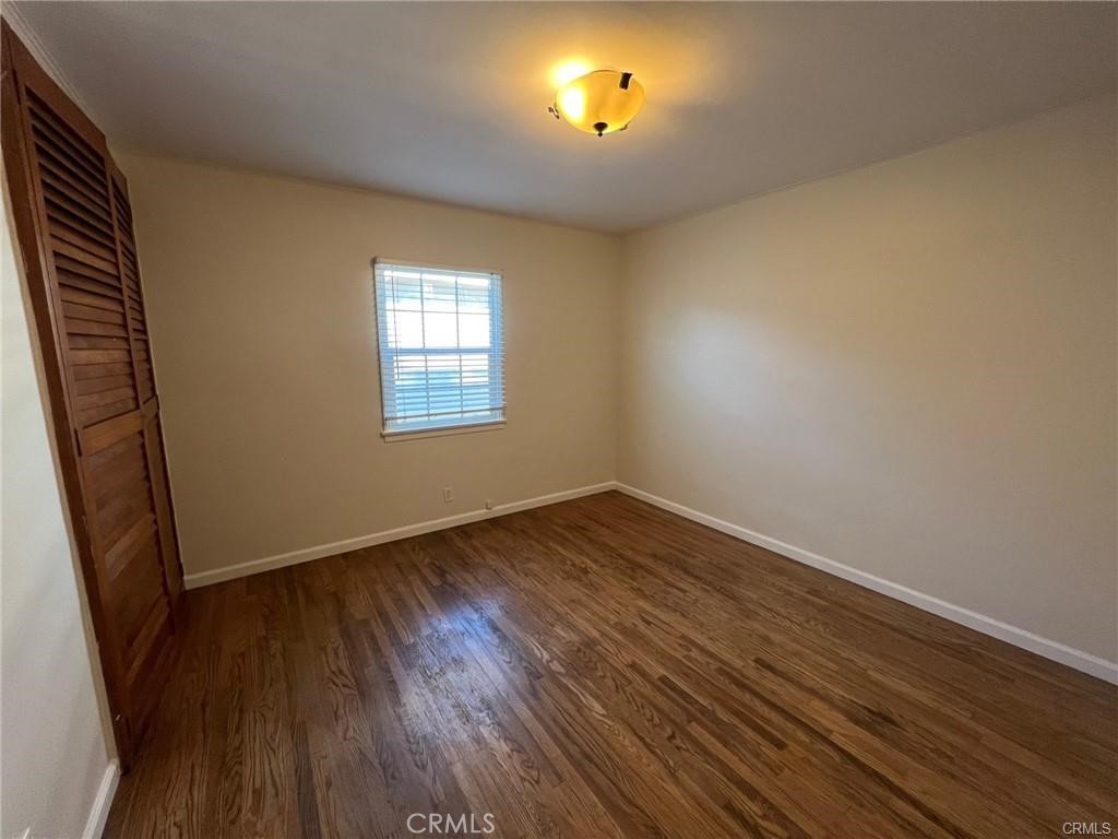 8400 Fordham Road Westchester, CA 90045 - Photo 20 of 25 an empty room with wooden floor and windows