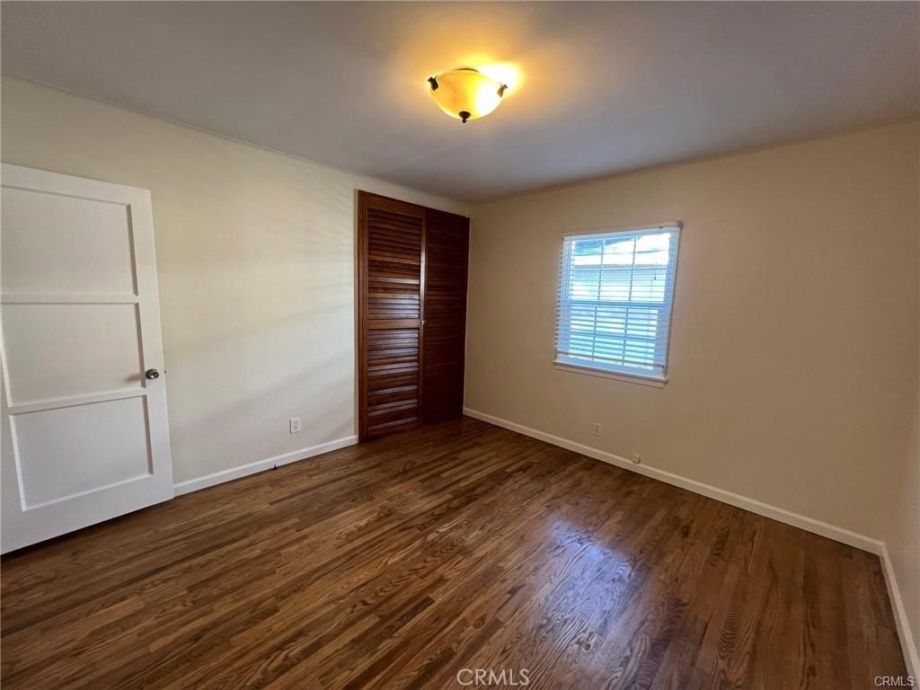 8400 Fordham Road Westchester, CA 90045 - Photo 21 of 25 an empty room with wooden floor and windows