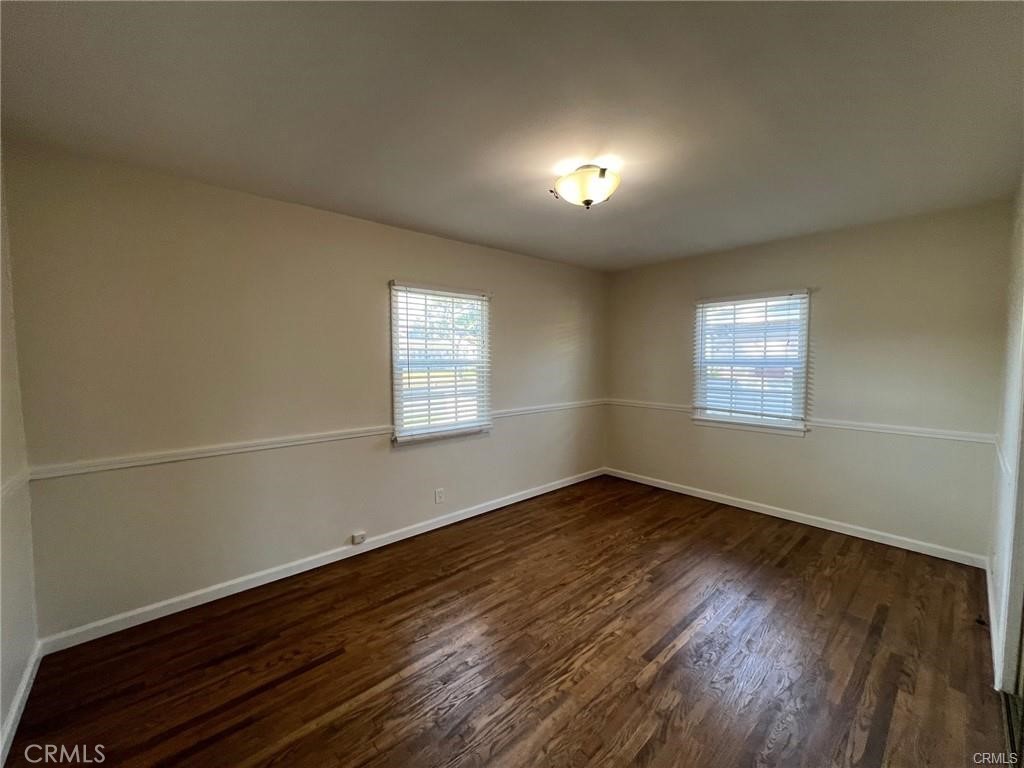 8400 Fordham Road Westchester, CA 90045 - Photo 22 of 25 an empty room with wooden floor and windows
