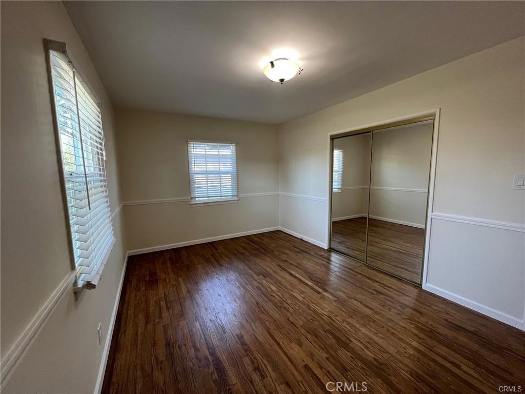 8400 Fordham Road Westchester, CA 90045 - Photo 23 of 25 an empty room with wooden floor and windows
