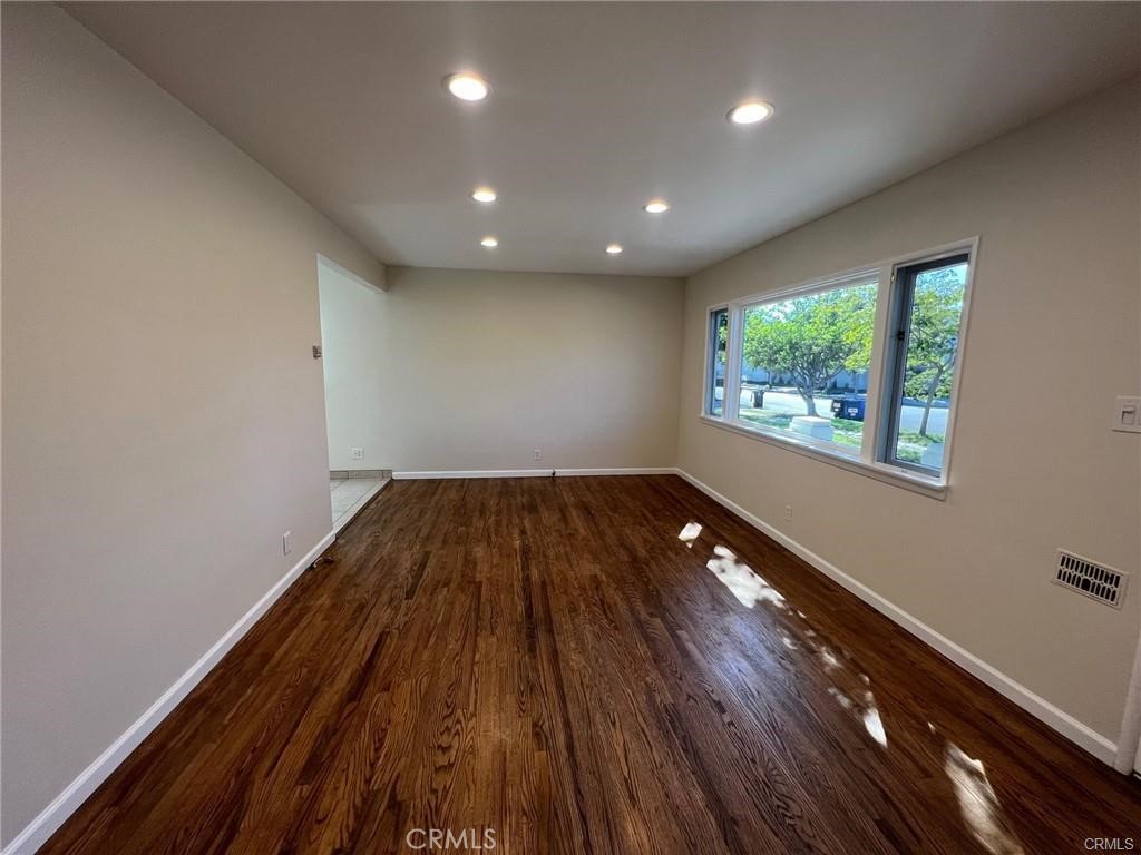 8400 Fordham Road Westchester, CA 90045 - Photo 24 of 25 wooden floor in an empty room with a window