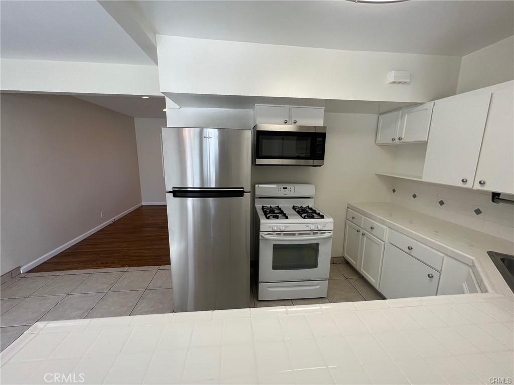 8400 Fordham Road Westchester, CA 90045 - Photo 6 of 25 a kitchen with a refrigerator sink and microwave