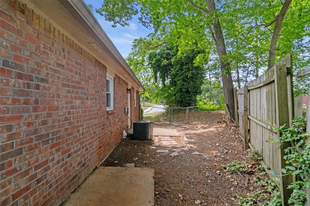 894 Five Forks Trickum Road Southwest Lawrenceville, GA 30046 - Photo 21 of 28 a view of backyard with green space