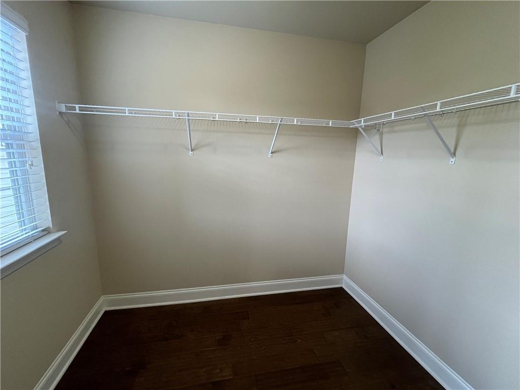 2299 Misty Ivy Court Buford, GA 30519 - Photo 11 of 26 a view of an empty walk in closet