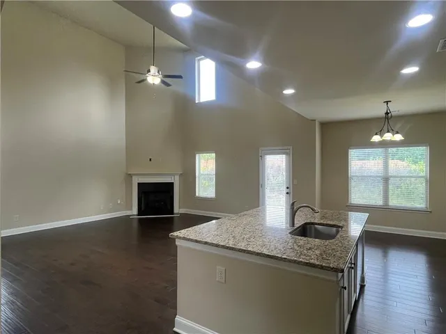 a view of a kitchen and a sink wooden floor fire place