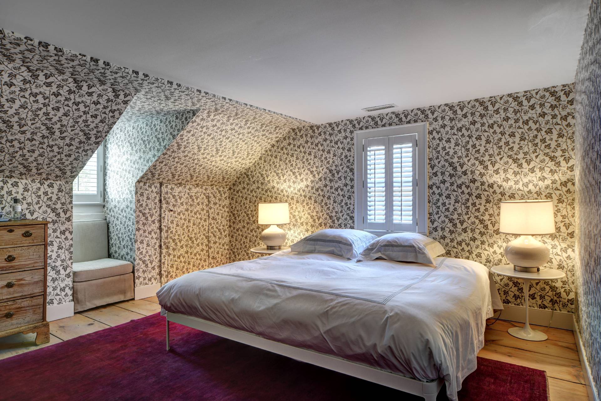 16 Jefferson Street Sag Harbor, NY 11963 - Photo 11 of 22 a bedroom with a large bed and a window